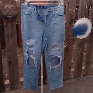 Woman's very distressed  Jeans button fly. Blue. 9 - 29.